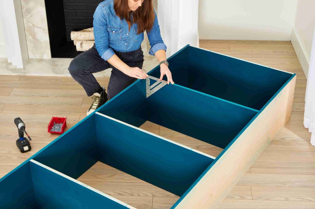 Carpenter working on built-in shelving in a Dublin home interior