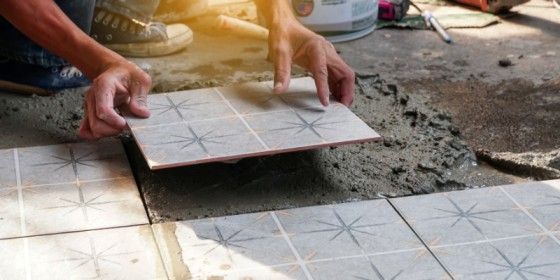 Professional tiler installing tiles in a Dublin home