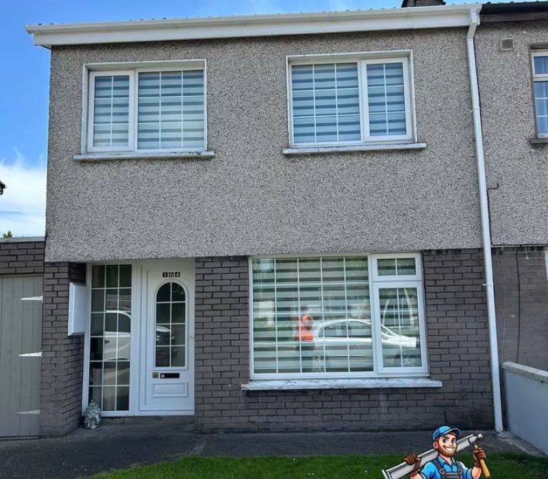 Semi-detached house with white fascia and gutters